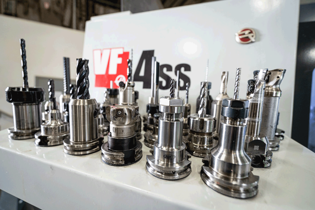 Various tooling drills neatly arranged on a display table.