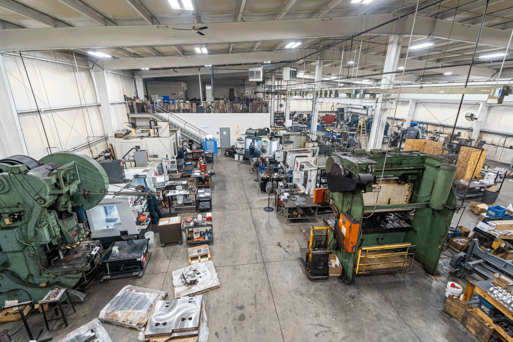 A view of a production floor full of various tooling and die making equipment.