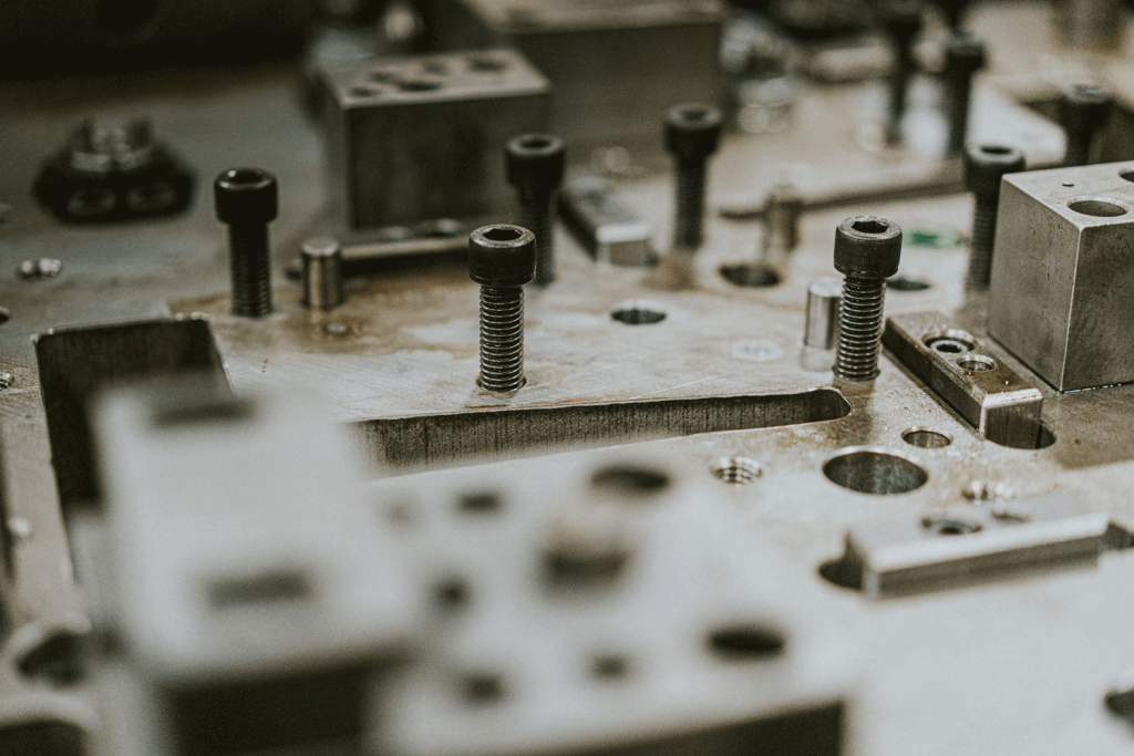 A variety of allen screws in a close-up shot of a die.