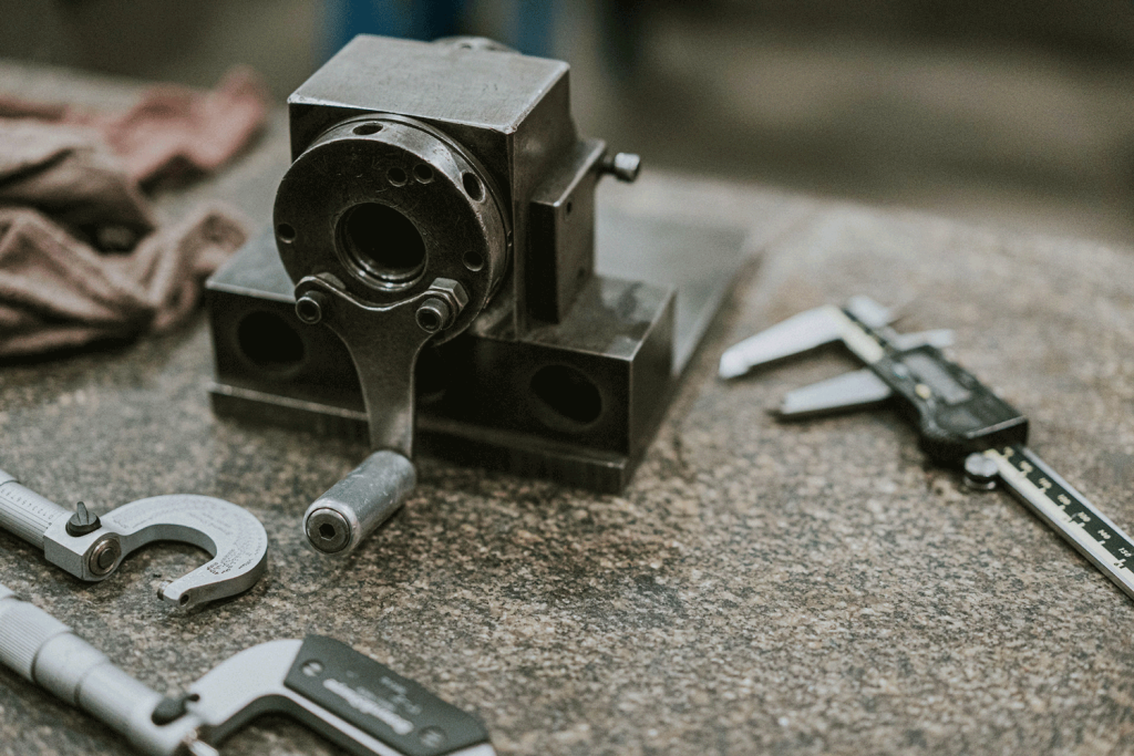 A variety of calipers are placed on a table, ready for use.