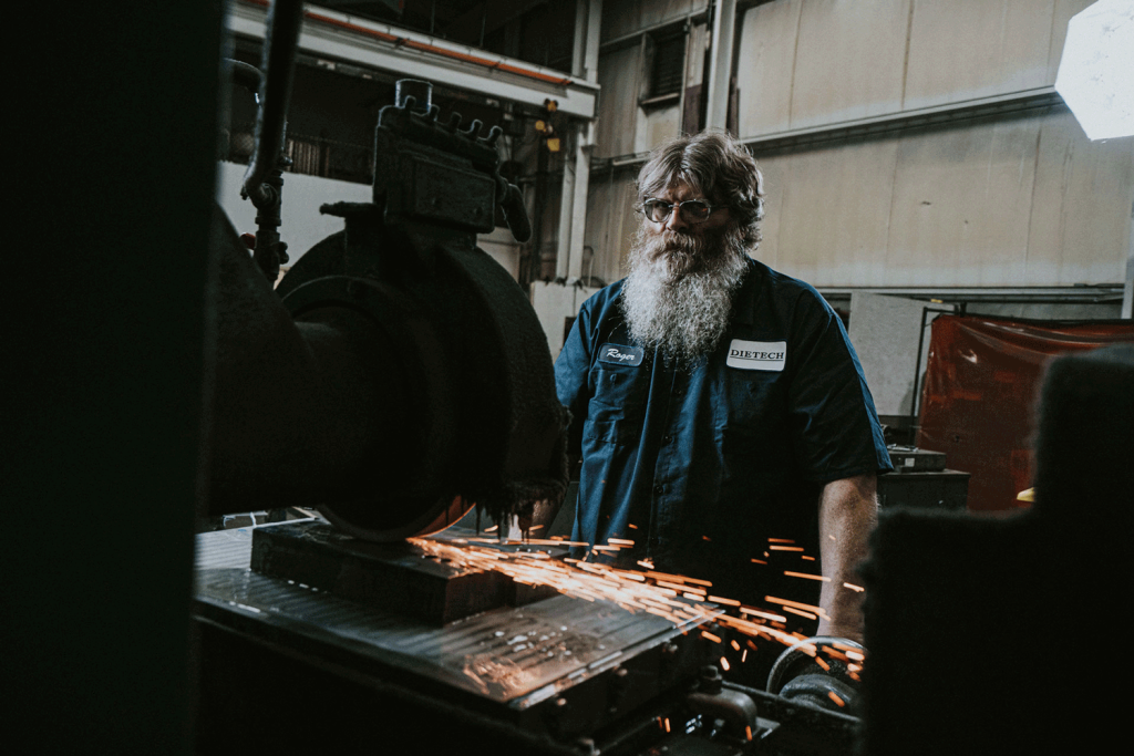 An image of a man with a beard and a flowing white beard.